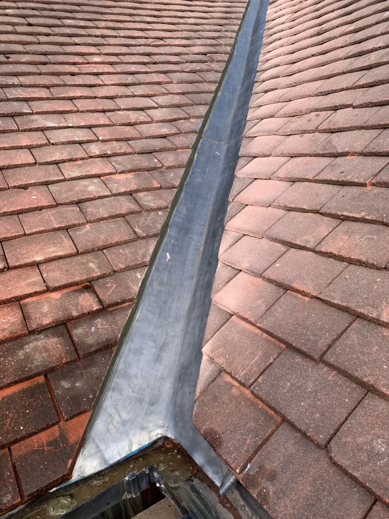 Lead valley in a tiled roof