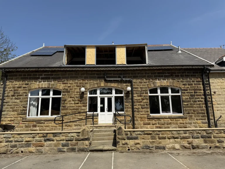 Stone building with new dormers going in near Runswick Bay