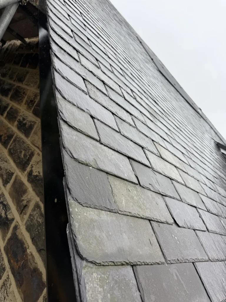 Slate verge against stonework near Runswick Bay