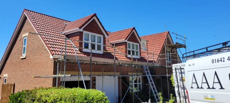 Dormer bungalow re-roofed in grey tiles